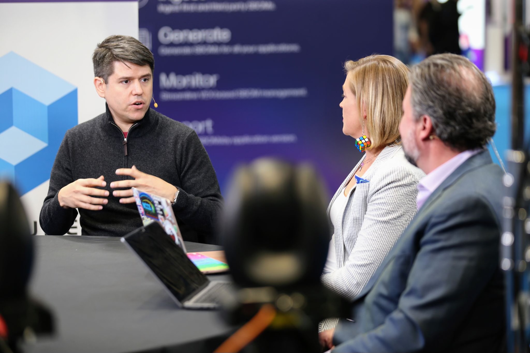 Daniel speaking at a conference